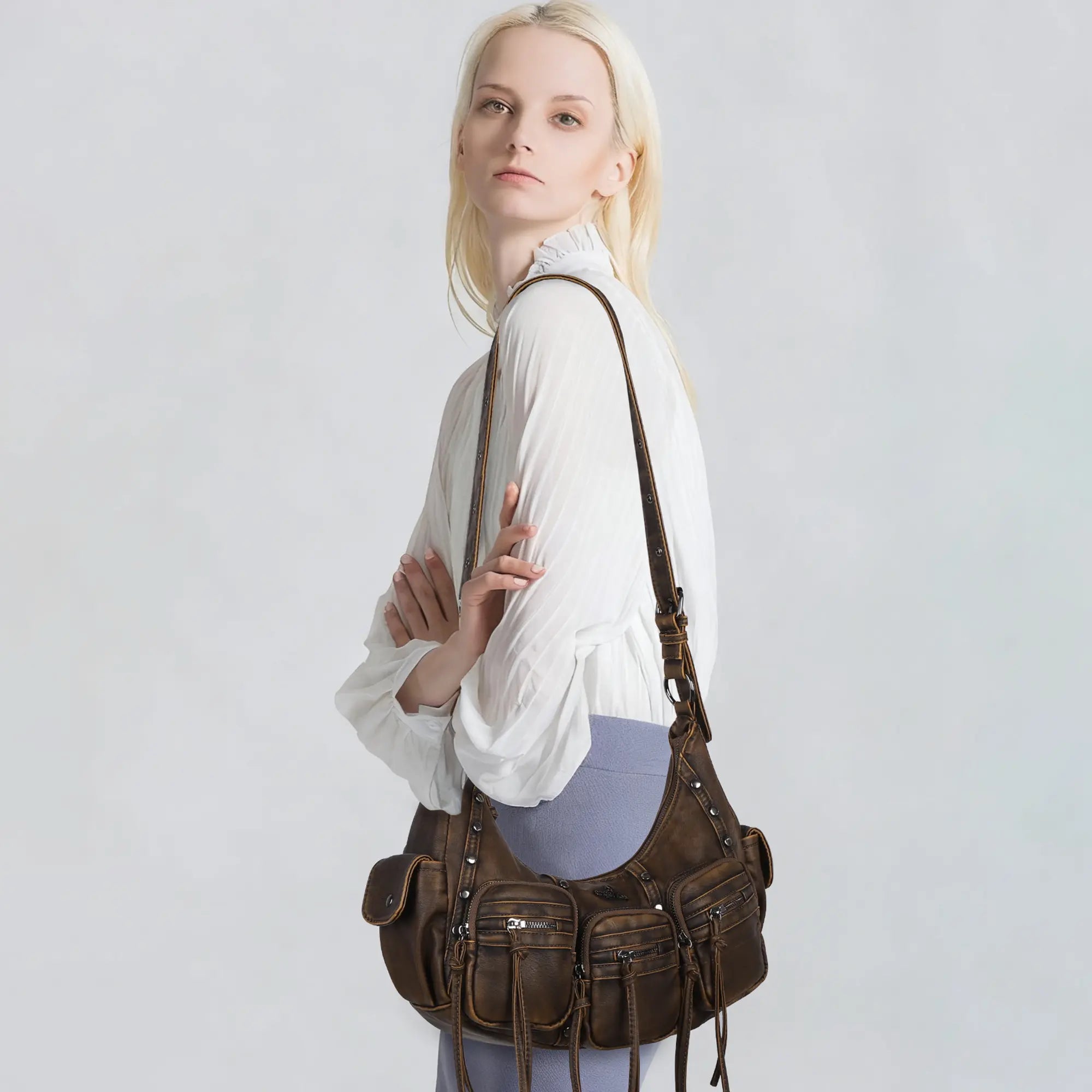 Multi-Pocket Crescent Shoulder Bag with Tassel Zipper Details